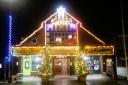 Caister village hall illuminated for Christmas.