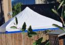 A police tent in one of the gardens in John Amner Close, off Lynn Road, in Ely, on October 3.