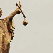Stock image depicting the scales of justice.