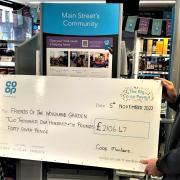 Deborah Curtis Watson of Friends of the Woodland Garden [known as Peacocks Meadow which began in 2017], receives a cheque from Main Street, Littleport Co-op’s Community Fund.