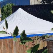 A police tent in one of the gardens in John Amner Close, off Lynn Road, in Ely, on October 3.