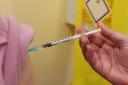 Eligible patients are being urged to book their Covid flu injections as soon as possible.