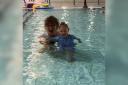 Ella with her swimming teacher, Rose