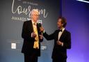 Alan Carr, winner of The East of England Tourism Awards 2021-2022's Outstanding Contribution to Tourism Award, on stage with host David Whiteley at last year's awards ceremony