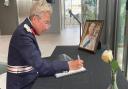 Mrs Julie Spence OBE QPM, the Lord Lieutenant of Cambridgeshire, signing a book of condolence after the death of HM Queen Elizabeth II.