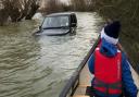 A stranded 4x4 in the flooded Welney Wash.