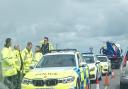 Police assess the aftermath of a fatal crash at Stonea, where a man in his 30s was pulled from a water-filled ditch