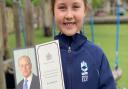 Eight-year-old Willow Barry with the thank you card she received from Her Majesty The Queen following Prince Philip's death.