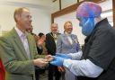 One of the Harry Specters chocolatiers gives HRH Prince Edward the chocolate bar he had made earlier during the visit.