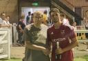 Gary Creak awarding Man of the Match to Charlie Root.