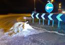 A lorry split on the A142 causing cockles to spill across the road.