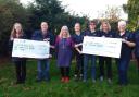 Members from the Sutton and Mepal District Poppy Appeal and the Elysian Riding for the Disabled Association collecting their cheques from Nellie's.