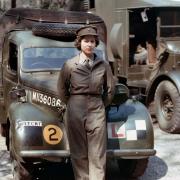 Princess Elizabeth stood in front of an L-plated truck during her time in the Auxiliary Territorial Service (ATS).