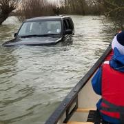 A stranded 4x4 in the flooded Welney Wash.