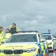 Police assess the aftermath of a fatal crash at Stonea, where a man in his 30s was pulled from a water-filled ditch