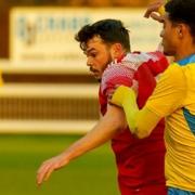 Ryan Gibbs (red) starred for Ely City in their 2-2 derby draw with March Town in the Eastern Counties Premier Division.