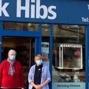 Independent shop owner Jacky Hibbert tops up furloughed employees’ wages thanks to success of free local delivery service. She is pictured (right) outside the shop with one of her employees, who is also called Jacky. Picture: BEN JOLLEY