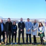 Soham Village College, alongside the town's football teams, is aiming to raise £125,000 for a 3G football pitch. Pictured are those working together to help raise the funds.