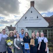 The Three Horseshoes team with the East of England Tourism Award for Pub of the Year