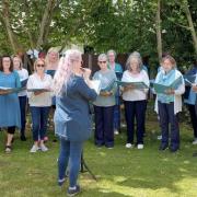 VocEly Community Choir performing at Lily House Care Home's picnic in the garden in June.