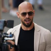 Social media influencer Andrew Tate can leave Romania but must remain within the European Union as he awaits trial on charges of human trafficking, rape and forming a criminal gang to sexually exploit women, a court has ruled (Vadim Ghirda/AP)