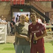 Gary Creak awarding Man of the Match to Charlie Root.