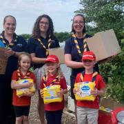 Scouts boost Ely Baby Bank with collection for their badge work