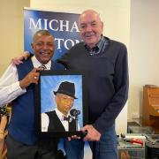 Ed Chivers presented Micheal Antony with the picture he had painted of him.