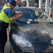 A vehicle illegally parked in a disabled bay in Ely High Street