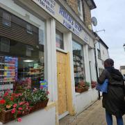 The front of Rima's Shop in Main Street, Littleport, has been boarded up following the burglary