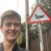 Cllr Vellacott with his duck warning sign.