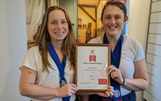 Jess and Sarah from Oliver Cromwell's House with the 'Hidden Gem' award.