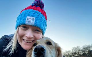 Sarah Borland and her dog, Trudy, after a marathon training session.