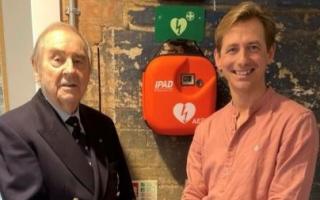 Richard Spendlove and Dan Schumann DL, founder of Viva Arts and Community Group, with the defibrillator,