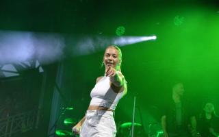 Becky Hill performing at Newmarket Racecourse.