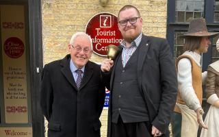 Mayor Cllr Chris Phillips stands with Matthew Routledge, Town Crier, outside of Oliver Cromwell’s House.