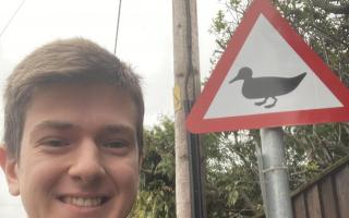 Cllr Vellacott with his duck warning sign.